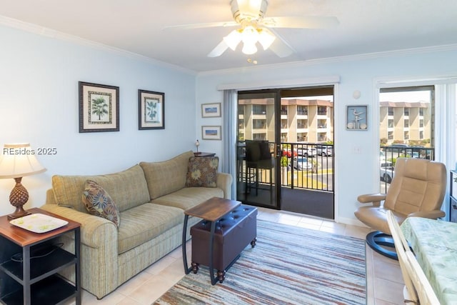 living room with light tile patterned floors, ornamental molding, and ceiling fan