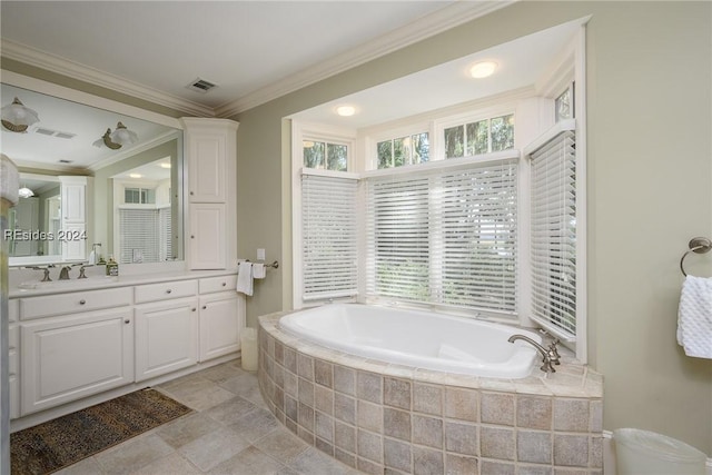 bathroom with crown molding, vanity, and tiled bath