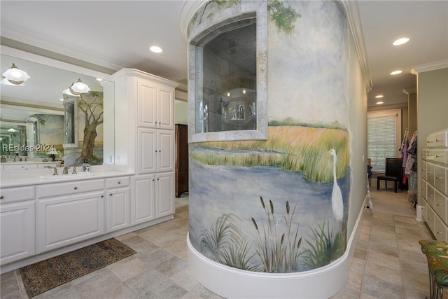 bathroom with crown molding and vanity