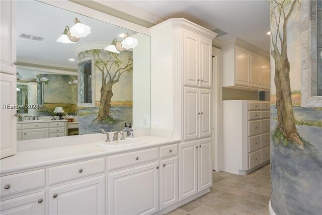 bathroom featuring ornamental molding and vanity