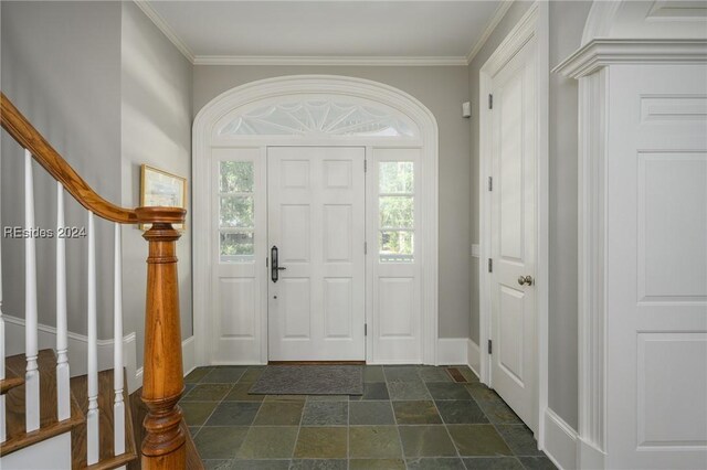 entryway featuring crown molding