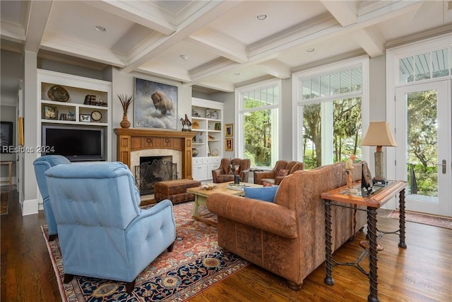 living room with a high end fireplace, dark wood-type flooring, built in features, and beamed ceiling