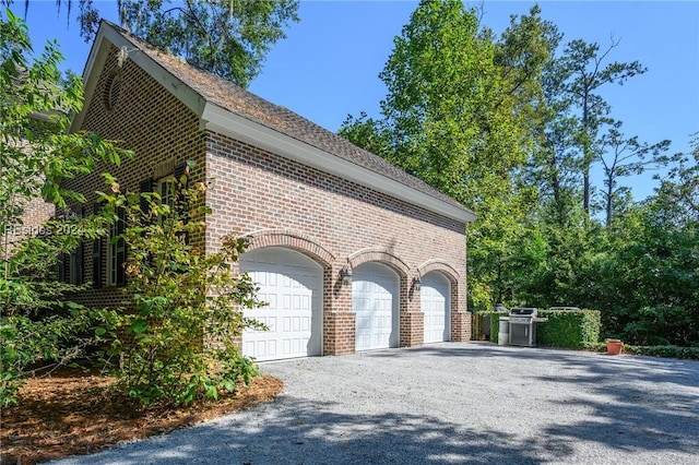 view of side of home with a garage