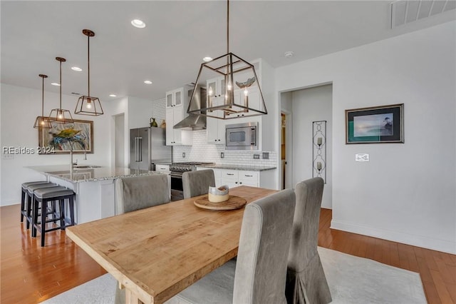 50 Gleneagle Ct, Bluffton, SC 29909 - dining space with sink and light hardwood / wood-style floors