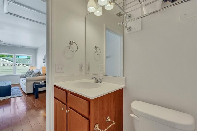 50 Gleneagle Ct, Bluffton, SC 29909 - bathroom featuring vanity, toilet, and wood-type flooring