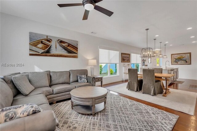 50 Gleneagle Ct, Bluffton, SC 29909 - living room with sink, hardwood / wood-style flooring, and ceiling fan with notable chandelier