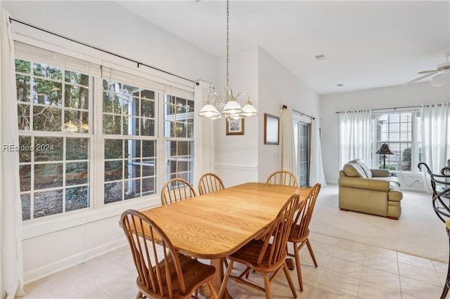 tiled dining area with ceiling fan