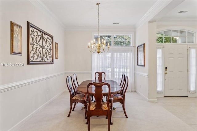 carpeted dining area featuring crown molding and a chandelier