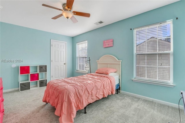 carpeted bedroom featuring ceiling fan