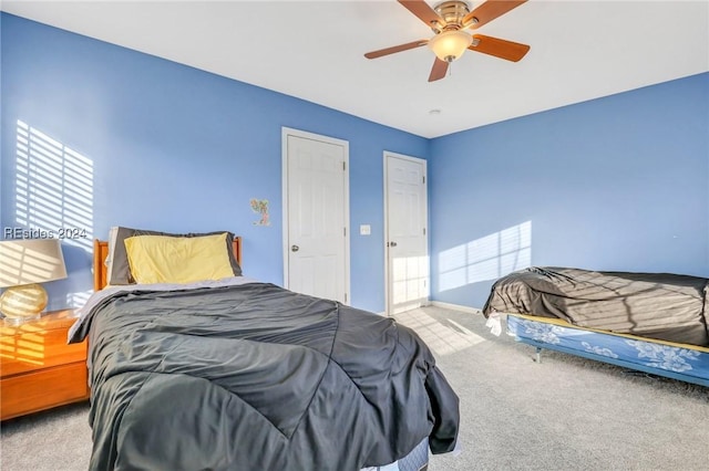 carpeted bedroom featuring ceiling fan