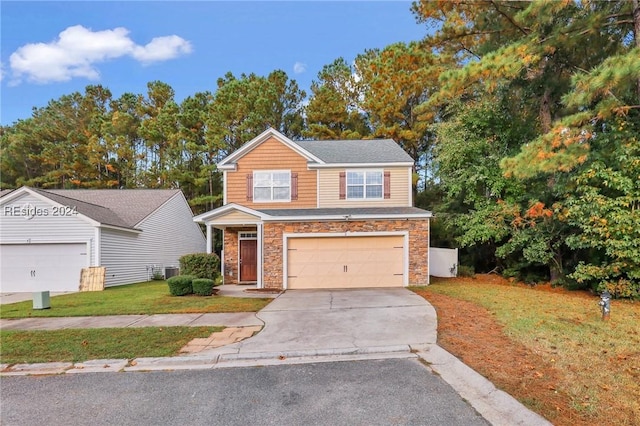 view of front of property featuring a garage and a front yard