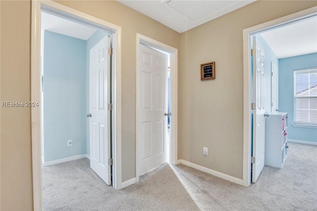 view of carpeted foyer entrance