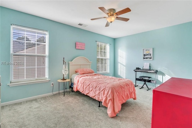 bedroom with ceiling fan and carpet floors