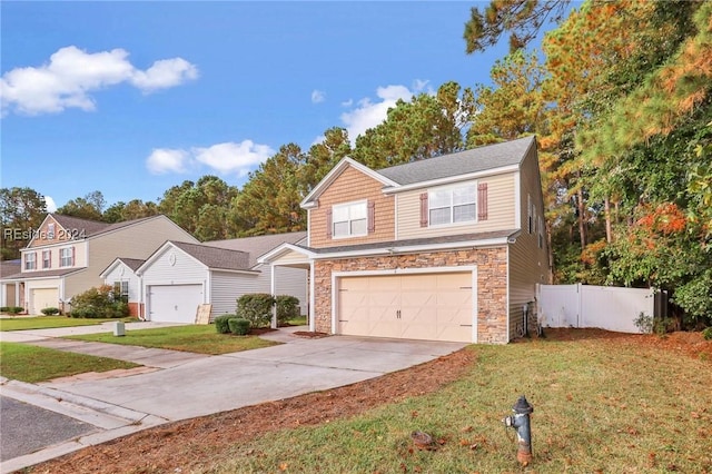 front of property featuring a garage and a front yard