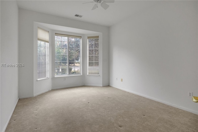 carpeted empty room with ceiling fan