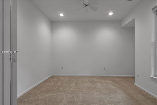 carpeted empty room with ceiling fan