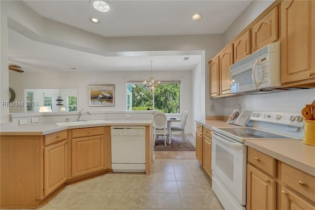 kitchen featuring light brown cabinetry, decorative light fixtures, sink, light tile patterned floors, and white appliances