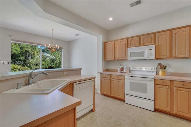 kitchen with decorative light fixtures, sink, white appliances, light brown cabinets, and an inviting chandelier