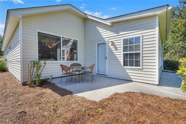 rear view of property featuring a patio area