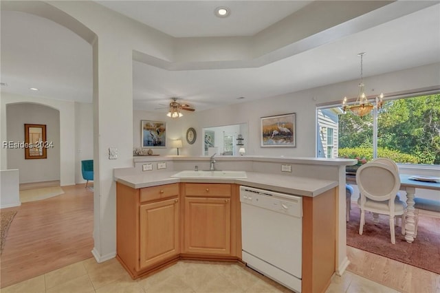 kitchen with pendant lighting, sink, light tile patterned floors, and white dishwasher