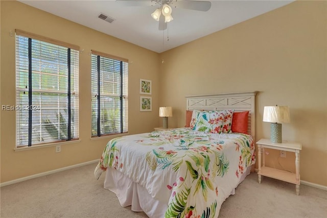 bedroom featuring ceiling fan and light colored carpet