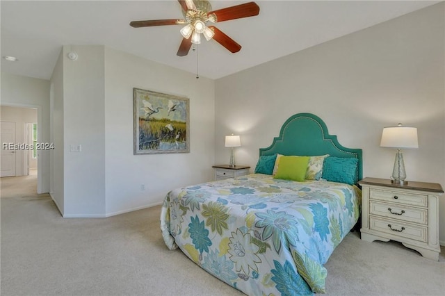 bedroom with light carpet and ceiling fan