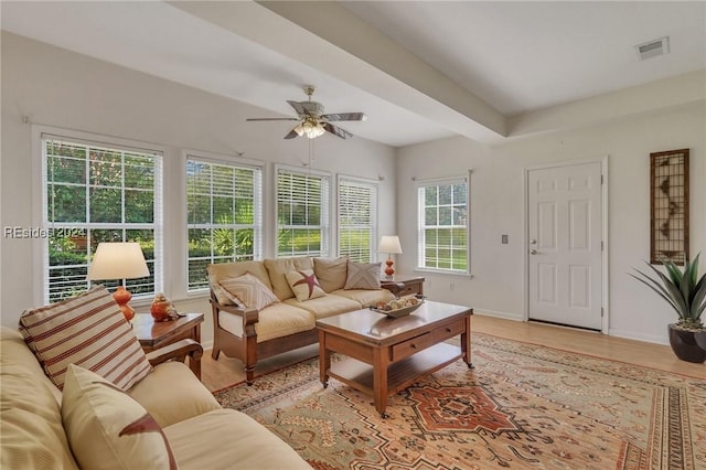 living room with ceiling fan and light hardwood / wood-style flooring