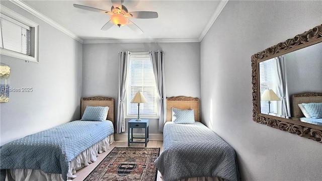 bedroom featuring crown molding and ceiling fan