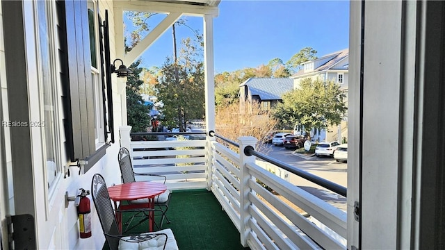 doorway to outside featuring dark carpet