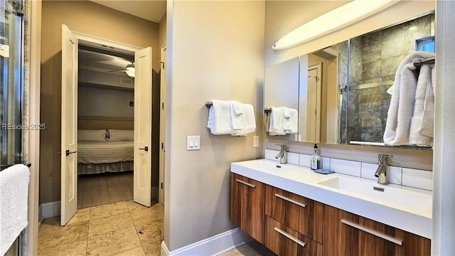 bathroom with ceiling fan and vanity