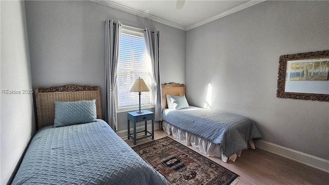 bedroom with hardwood / wood-style flooring, ceiling fan, and ornamental molding