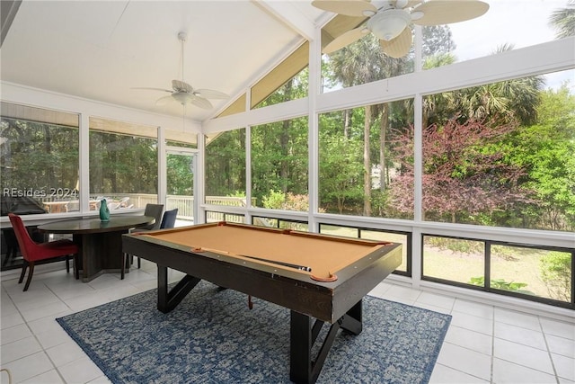 playroom with light tile patterned floors, vaulted ceiling, and a healthy amount of sunlight