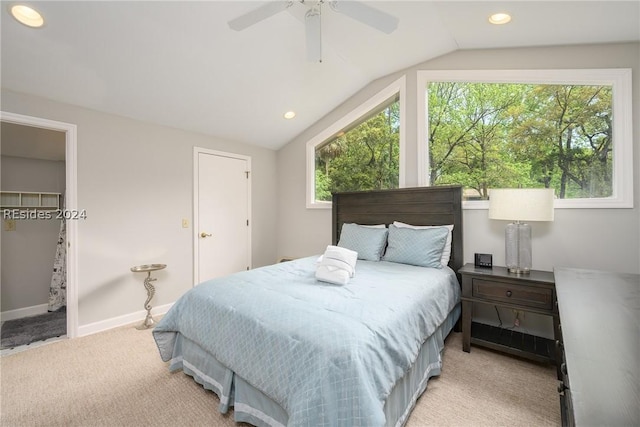 carpeted bedroom featuring ceiling fan and vaulted ceiling