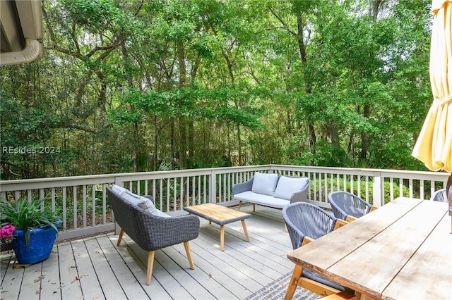 wooden deck with an outdoor living space