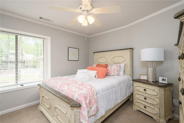 bedroom with crown molding, ceiling fan, light colored carpet, and multiple windows