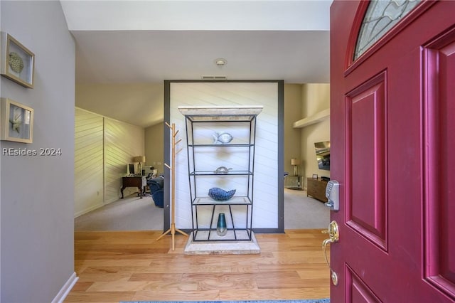 foyer with light carpet