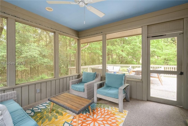 sunroom featuring ceiling fan