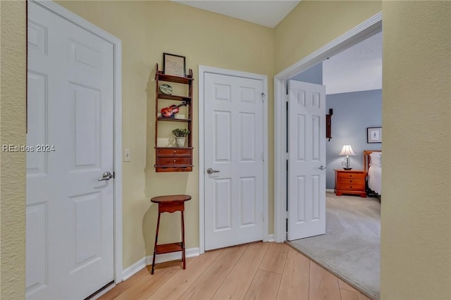 corridor featuring light hardwood / wood-style flooring