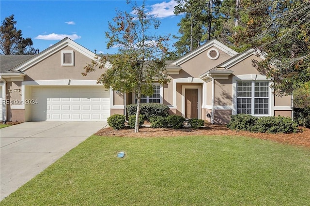 view of front of home featuring a garage and a front lawn