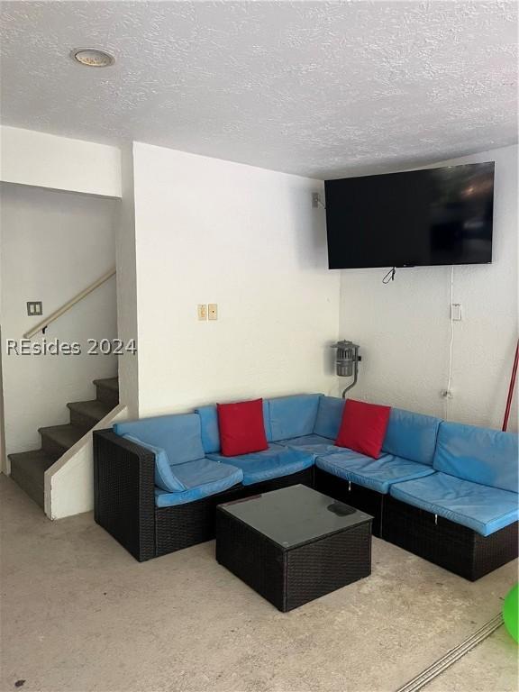 living room featuring a textured ceiling