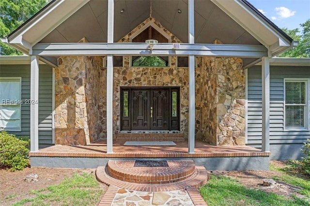 entrance to property featuring a porch