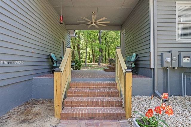 exterior space with ceiling fan