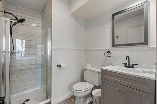 bathroom featuring vanity, toilet, and an enclosed shower