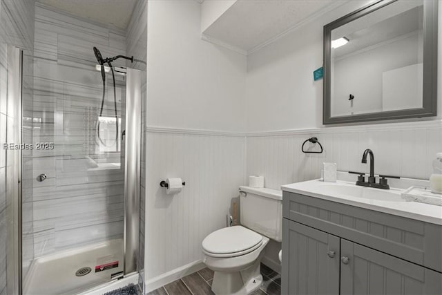 bathroom with walk in shower, vanity, and toilet