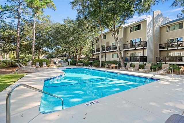 view of swimming pool with a patio area