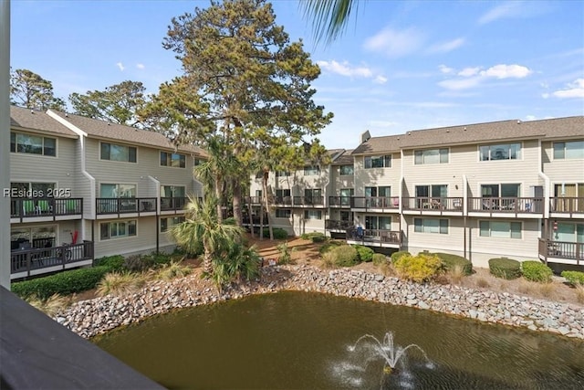 view of home's community featuring a water view