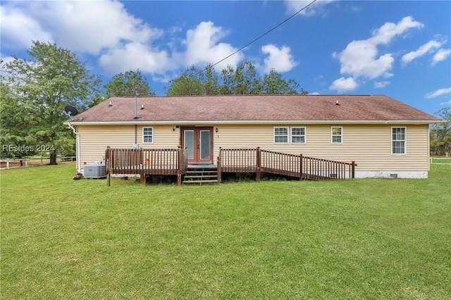 rear view of house featuring a yard, a deck, and central air condition unit