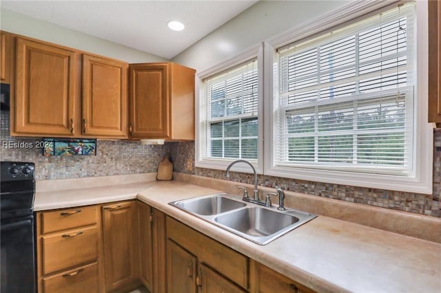 kitchen featuring sink and electric range oven