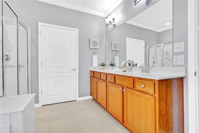 bathroom featuring tile patterned floors, ornamental molding, an enclosed shower, and vanity