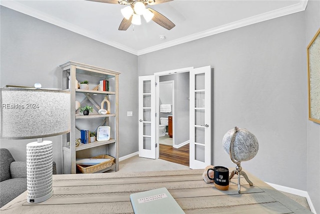 interior space with carpet floors, ornamental molding, french doors, and ceiling fan